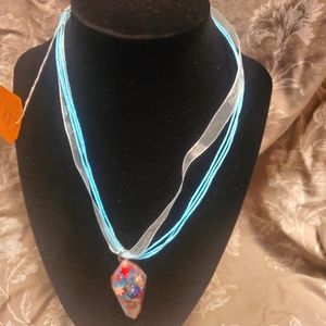 Red white bull and purple resin necklace